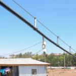 Innovative aerial water piping saving slum